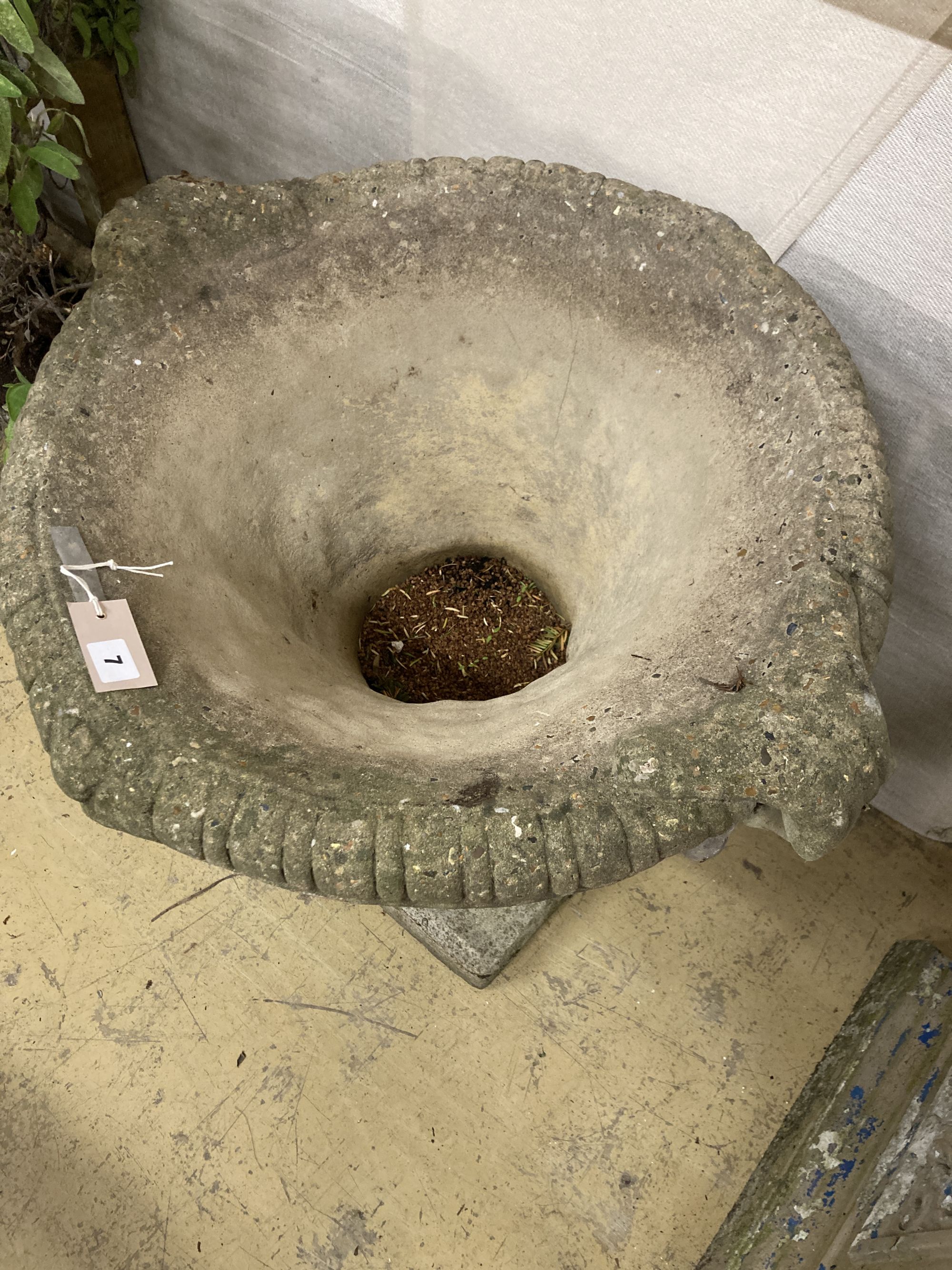 A reconstituted stone campana garden urn, width 66cm, depth 60cm, height 64cm